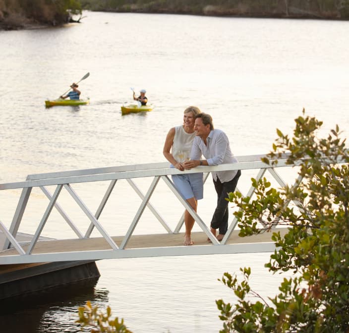 couple in bridge looking happy